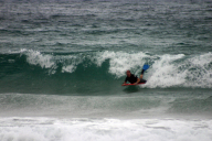 Bodyboarding with fin showing
