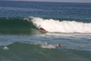 Bodyboarder catching a wave